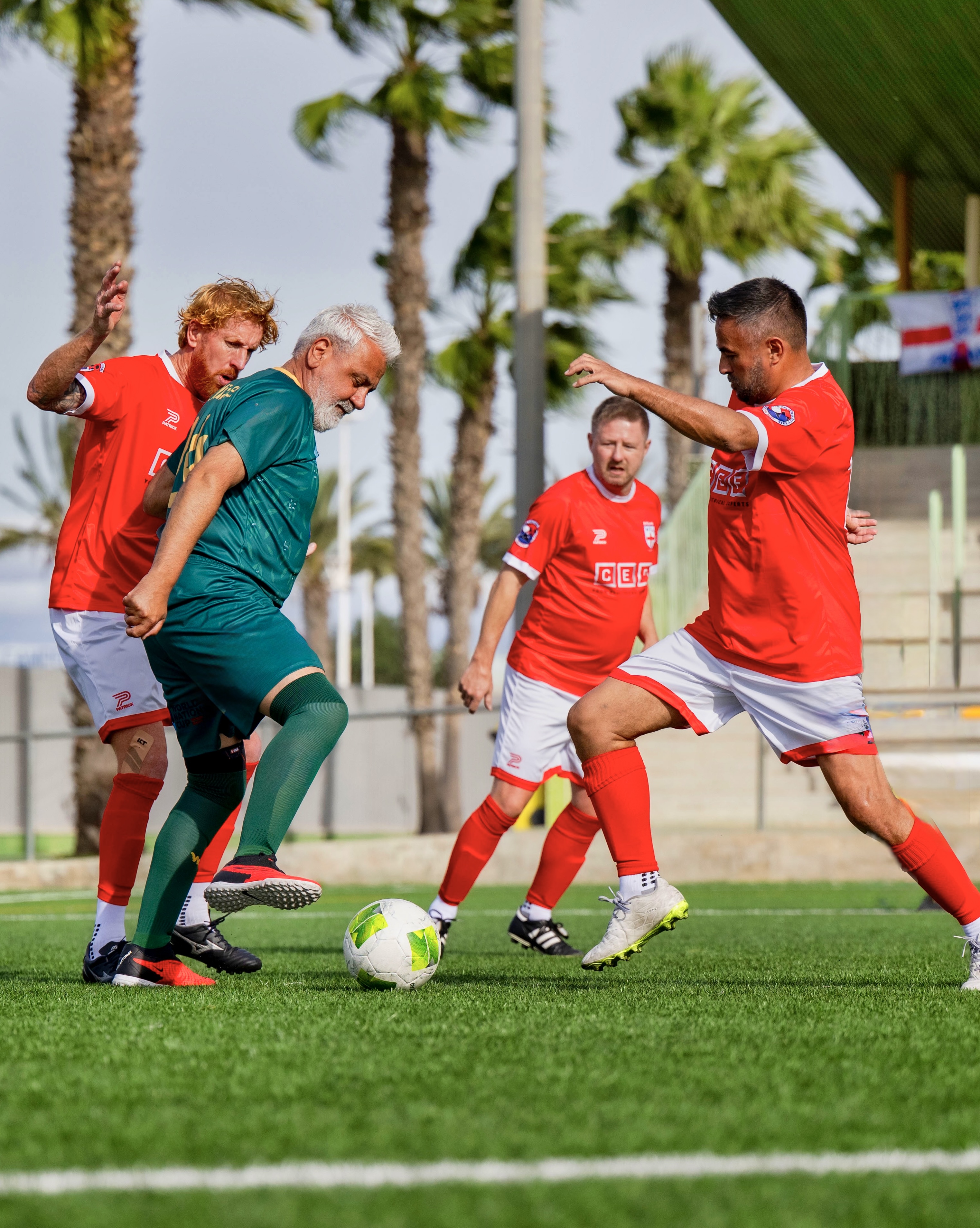 Over 70s players competing for the ball