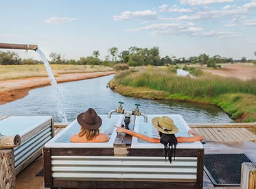Relaxing in natural hot springs in Outback Queensland