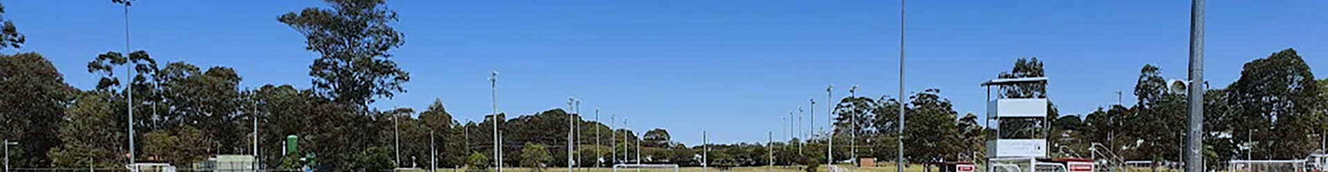 Redlands FC playing fields under a blue Queensland sky