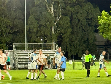 Players gathered on the field at Redlands FC
